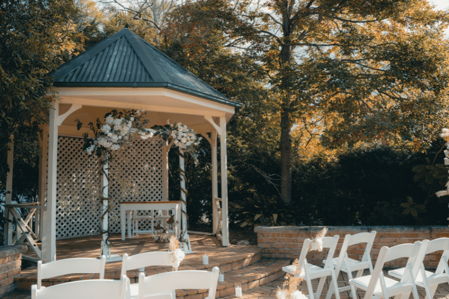 Timber garden gazebo set for a wedding ceremony among the trees at Dural Club