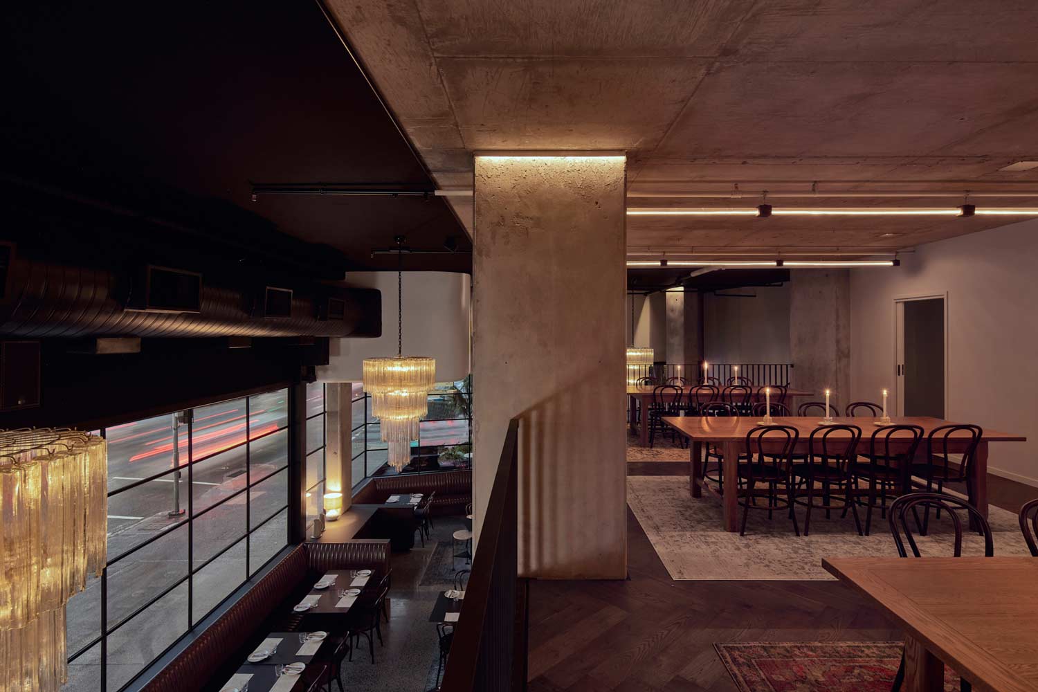 Petite's mezzanine private dining table, candlelit, overlooking the main dining room below