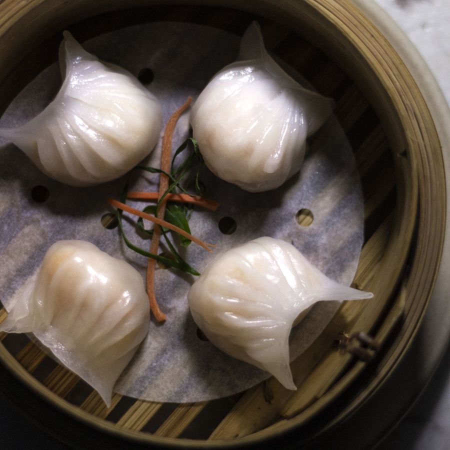 Har Gao translucent prawn dumplings in a bamboo steamer