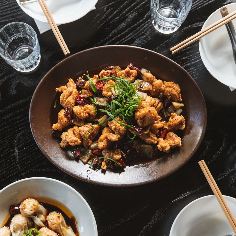 Yan Su Ji salt and pepper chicken pieces served with wontons in chilli oil