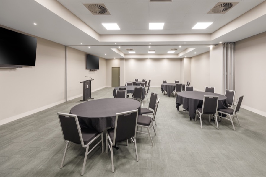 The Big Room set cabaret-style with lectern