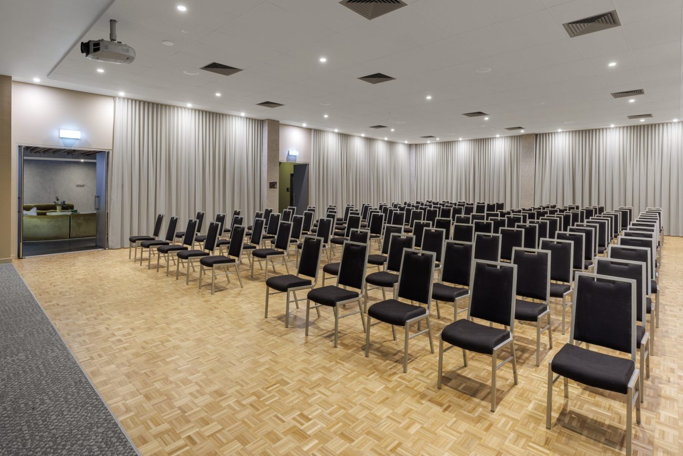 The Big Room set cabaret-style with lectern