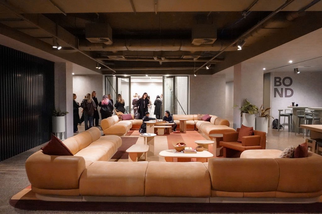 Guests gathering in the ground-floor lounge and breakout area