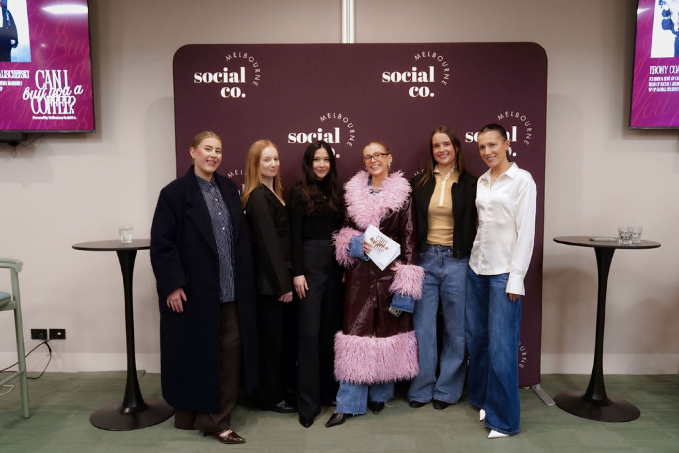 Group of guests at an event backdrop
