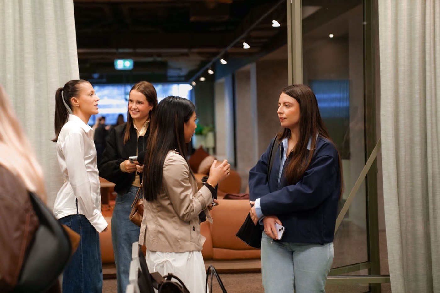 Guests networking in the lounge area